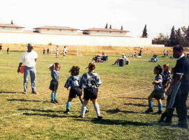 Feet on the ground, ball behind the head...