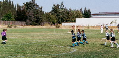 3 strikers in front of the Cougar's goalie